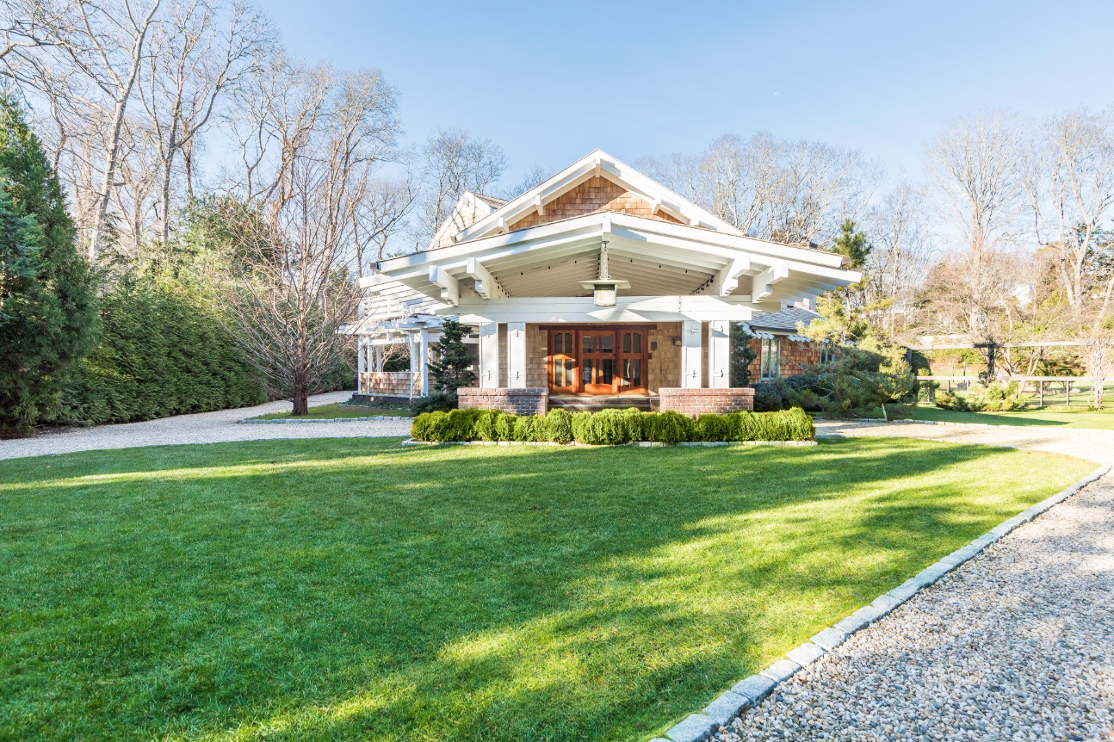 30 East Hollow Road East Hampton, NY 11937 - Photo 27 of 29 a front view of a house with garden and sitting area