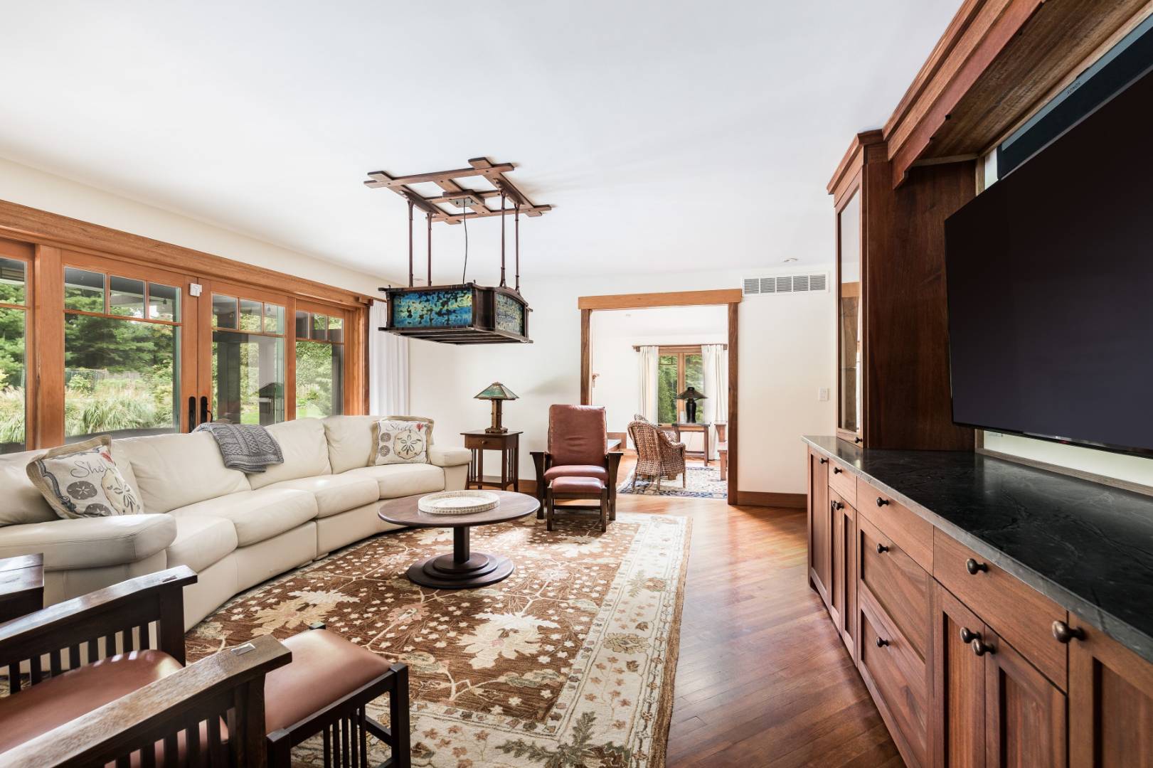 30 East Hollow Road East Hampton, NY 11937 - Photo 8 of 29 a living room with furniture and a flat screen tv