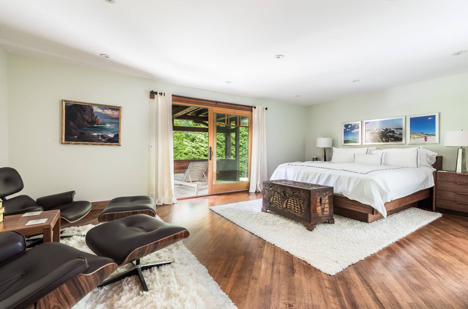 30 East Hollow Road East Hampton, NY 11937 - Photo 9 of 29 a spacious bedroom with a bed a couch and a window