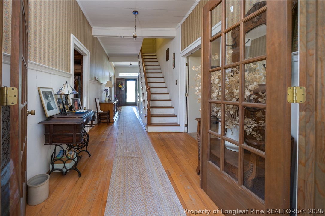 6346 Dunn Road Roseboro, NC 28382 - Photo 6 of 39 a hallway with wooden floor and furniture