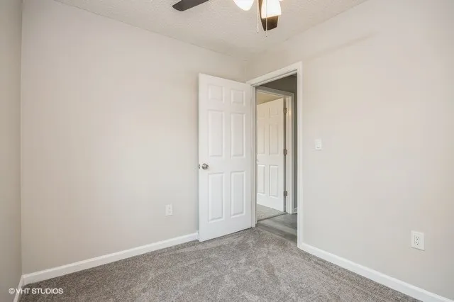 an empty room with a empty space and windows