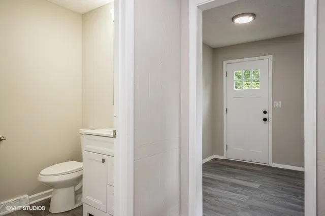 a bathroom with a toilet and a sink