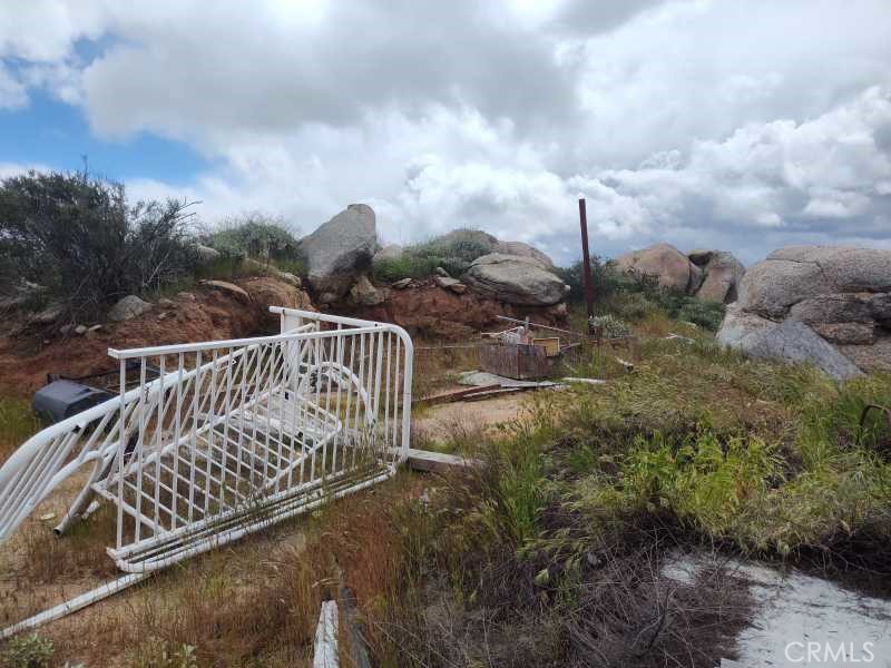 2 California Hemet, CA 92545 - Photo 7 of 7 a view of a roof deck with two couches and wooden fence