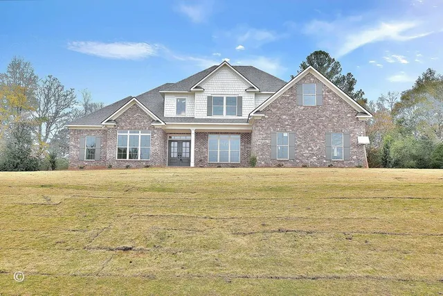 a front view of a house with a ocean view