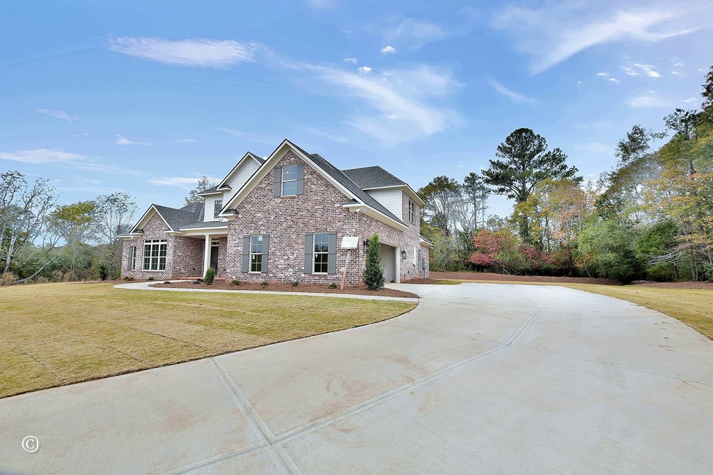 5905 Linley Court Midland, GA 31820 - Photo 2 of 41 a front view of a house with a yard and garage