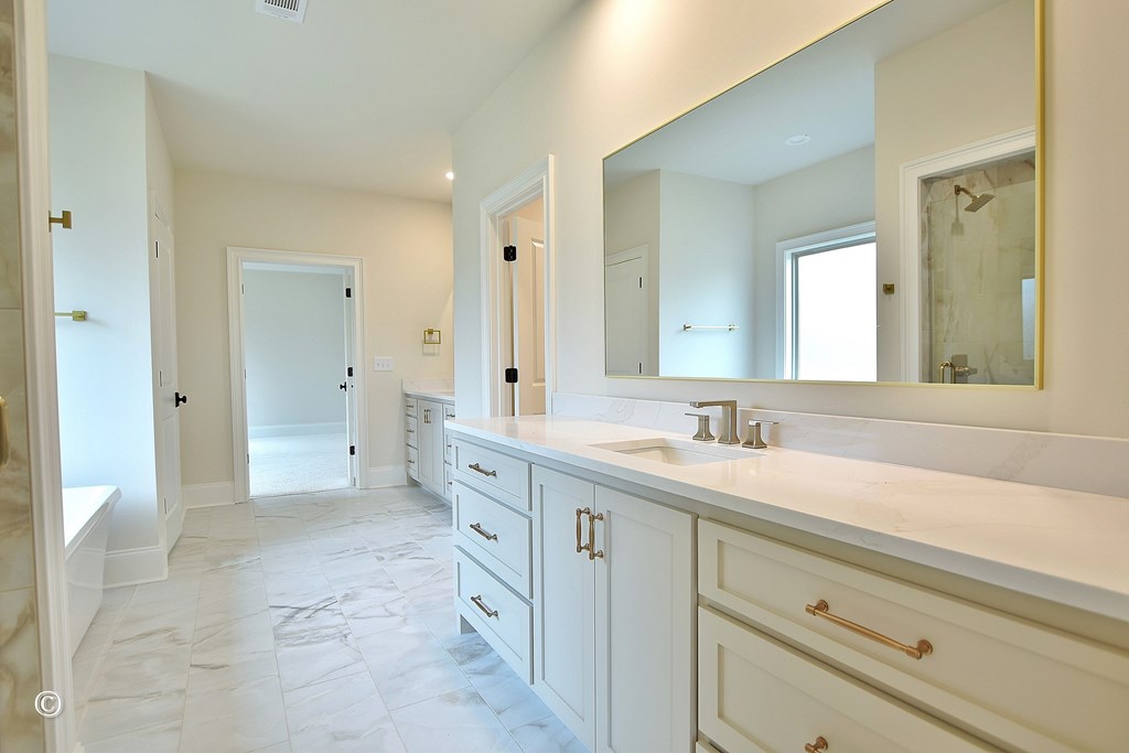 5905 Linley Court Midland, GA 31820 - Photo 22 of 41 a spacious bathroom with a granite countertop sink mirror and a