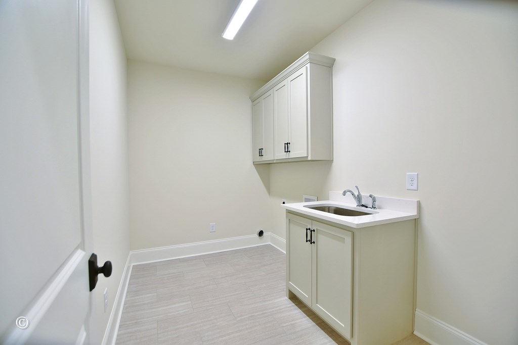 5905 Linley Court Midland, GA 31820 - Photo 26 of 41 a utility room with a sink a vanity and mirror