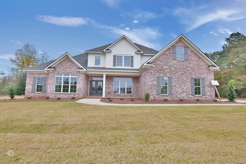 5905 Linley Court Midland, GA 31820 - Photo 3 of 41 a front view of a house with a garden and porch
