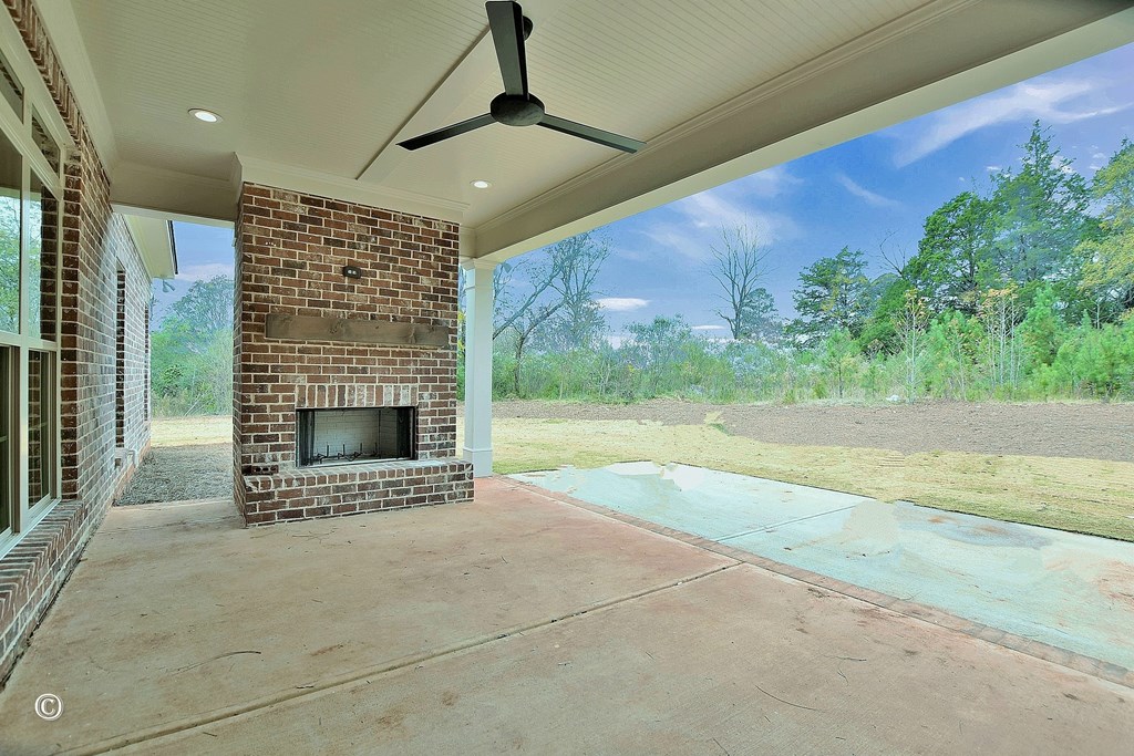 5905 Linley Court Midland, GA 31820 - Photo 34 of 41 a view of an empty room with a fireplace and garden