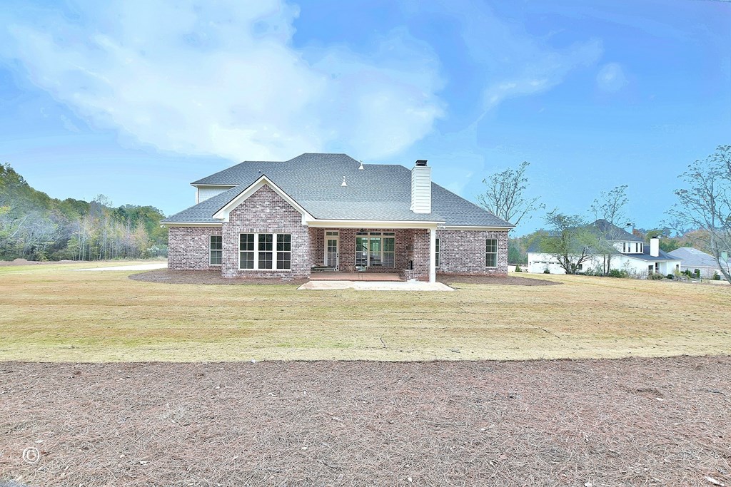 5905 Linley Court Midland, GA 31820 - Photo 35 of 41 a front view of a house with a big yard and a large tree