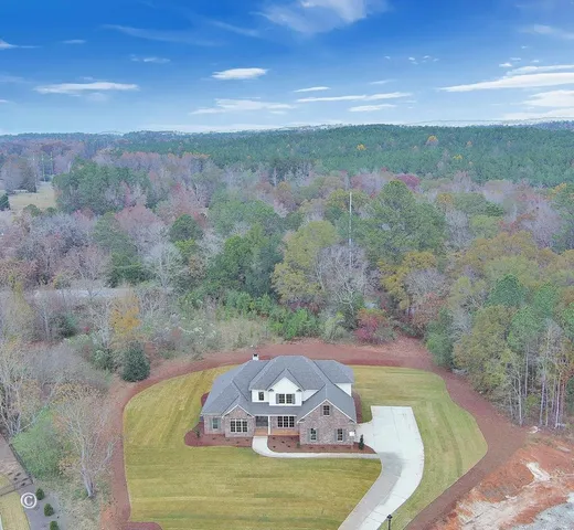 a view of swimming pool with a yard