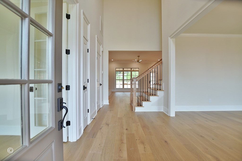 5905 Linley Court Midland, GA 31820 - Photo 4 of 41 a view of a hallway with wooden floor and staircase