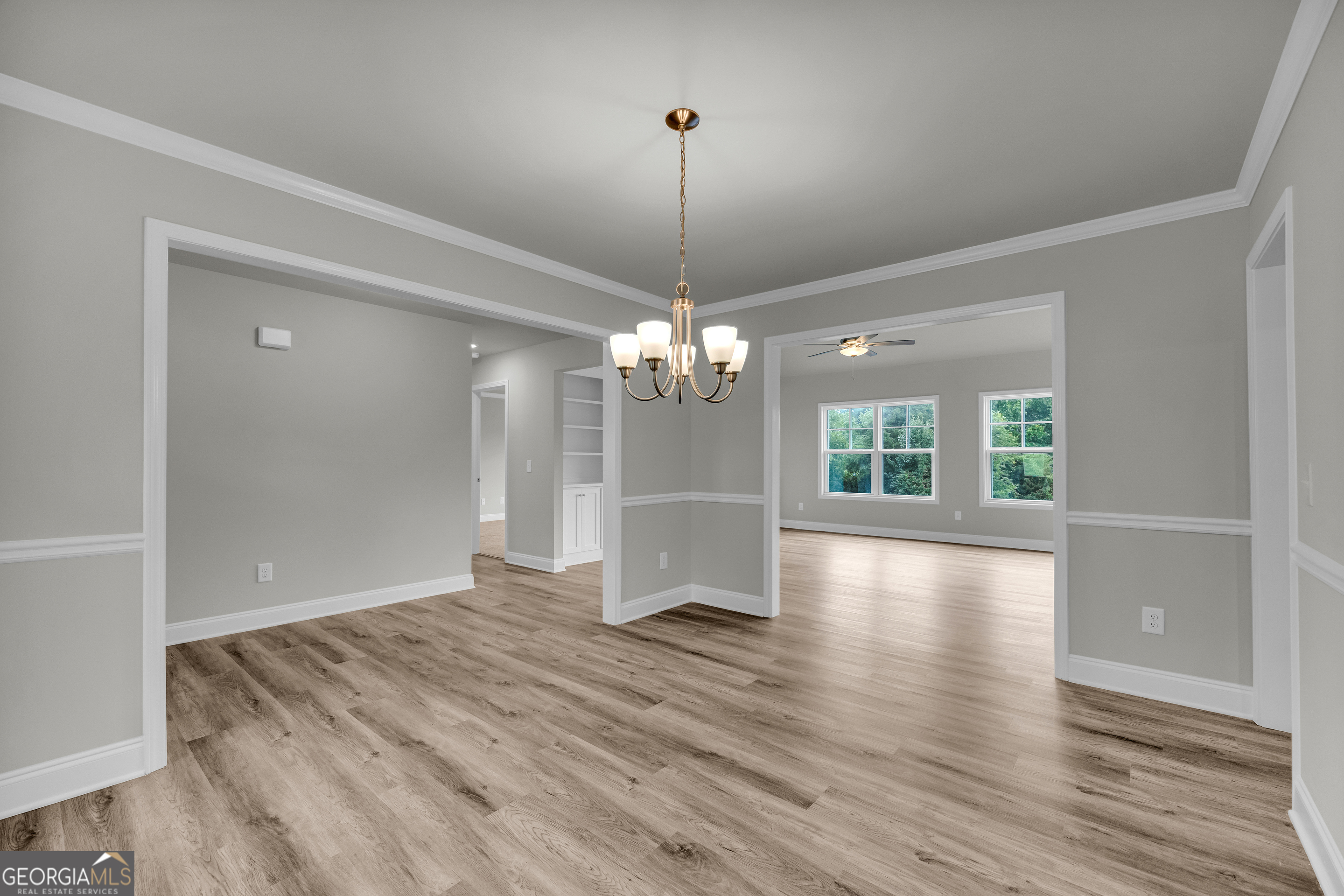 110 Sewell Road Lavonia, GA 30553 - Photo 26 of 73 a view of a room with wooden floor chandelier and windows