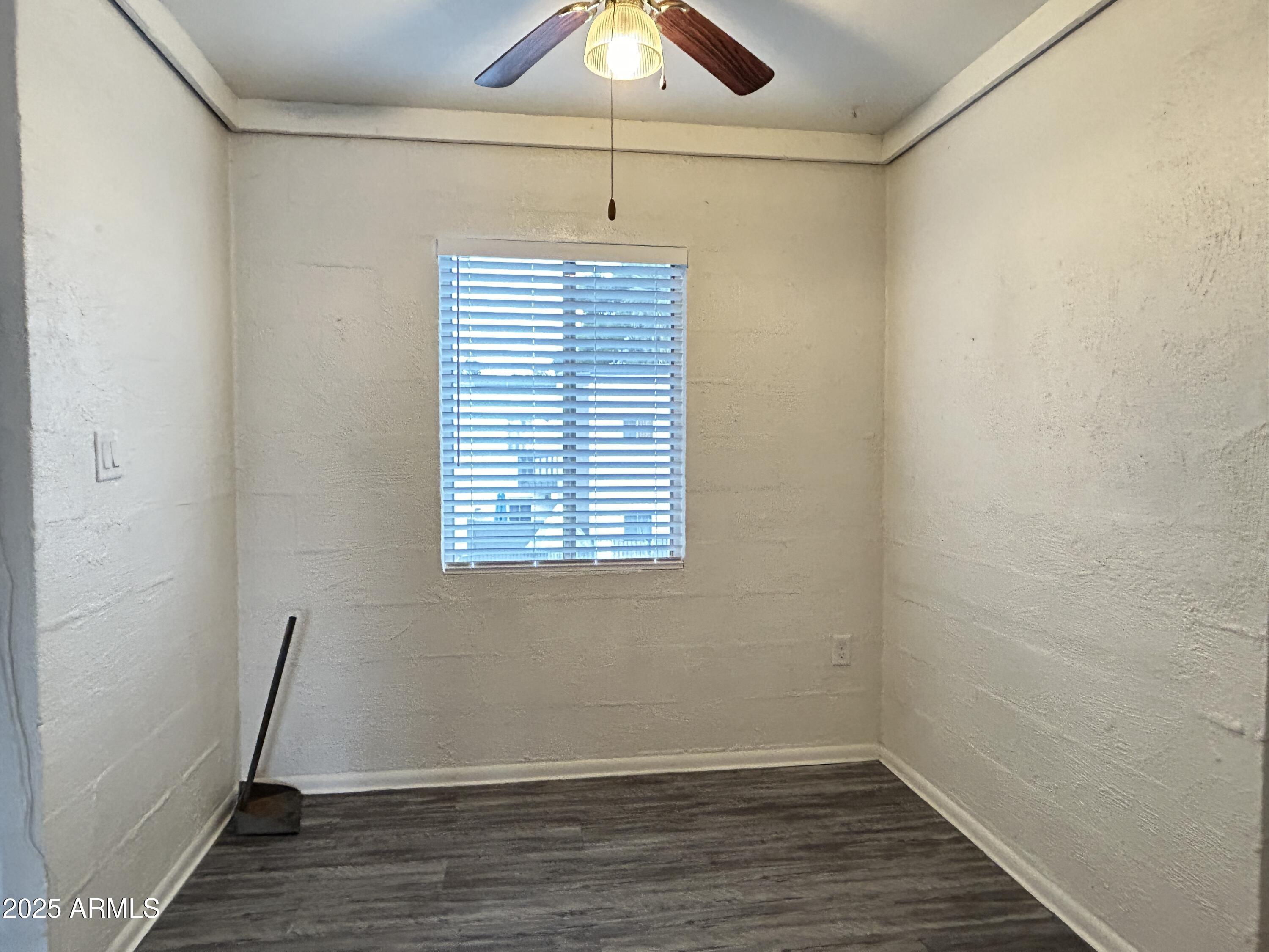 6236 North 16th Street, Unit 19 Phoenix, AZ 85016 - Photo 11 of 18 a view of a room with wooden floor and window