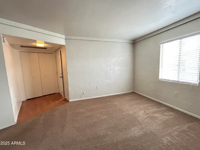 a view of an empty room with a window