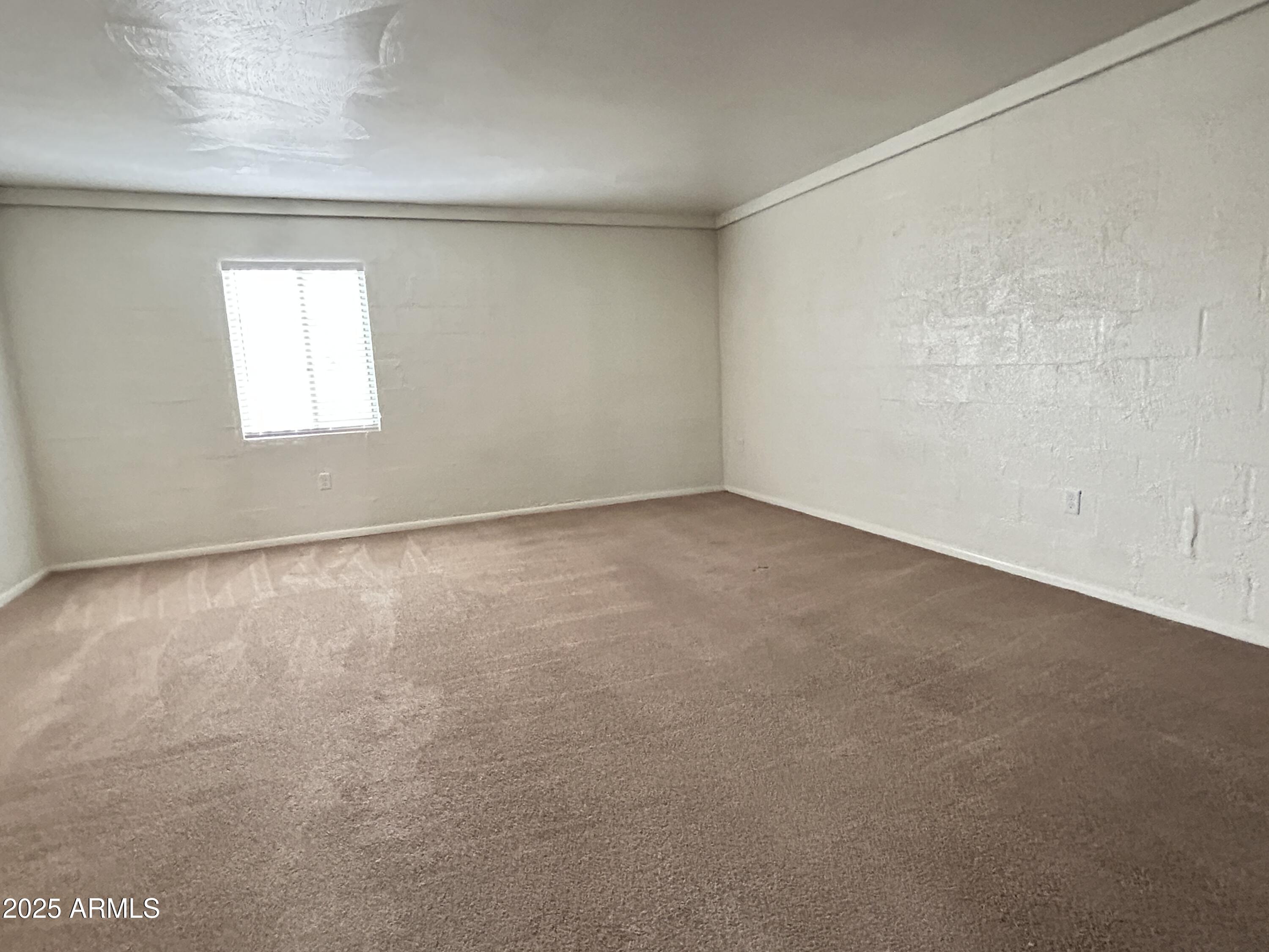 6236 North 16th Street, Unit 19 Phoenix, AZ 85016 - Photo 6 of 18 an empty room with a window