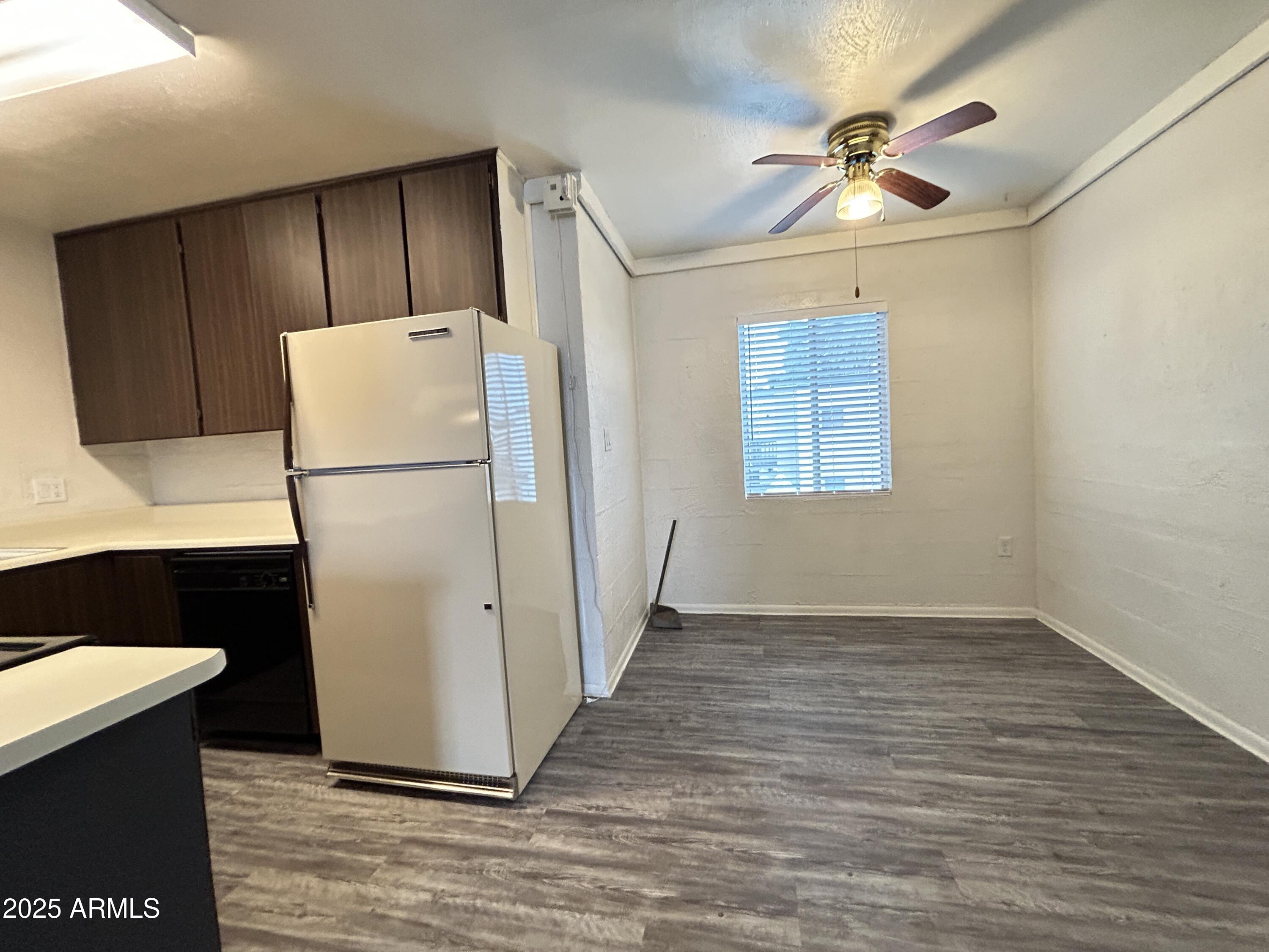 6236 North 16th Street, Unit 19 Phoenix, AZ 85016 - Photo 10 of 18 a kitchen with a refrigerator a stove top oven a sink and a dishwasher