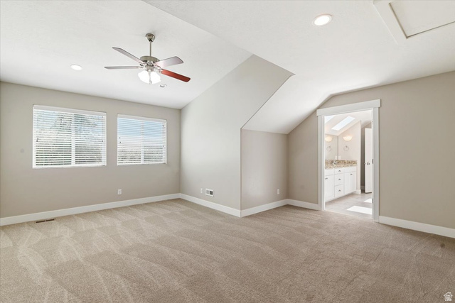 857 225 South Springville, UT 84663 - Photo 10 of 23 Spacious room featuring vaulted ceilings, recessed lighting, neutral-toned carpeting, a ceiling fan, and two windows with horizontal blinds