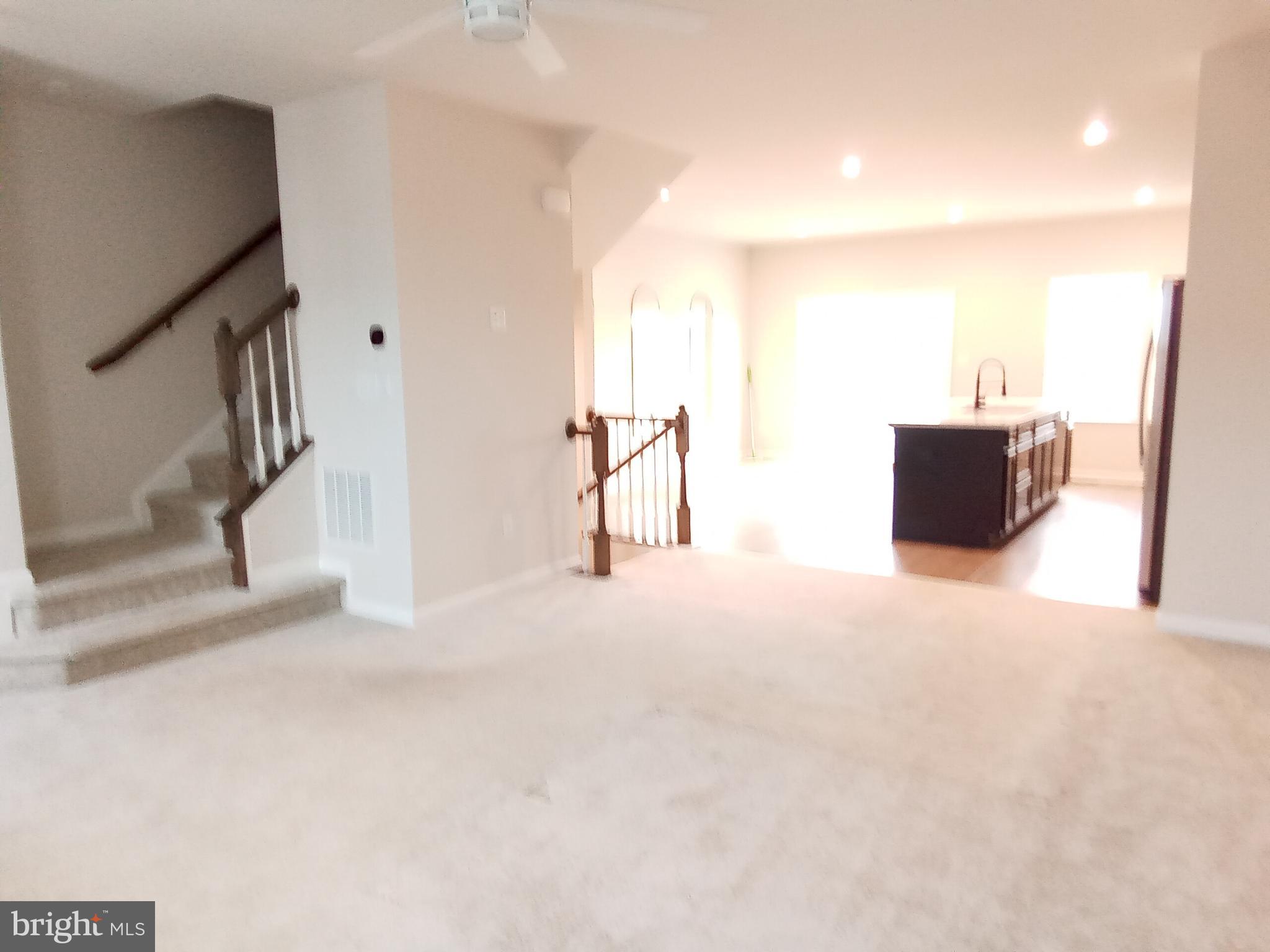 31 Roundstone Run Swedesboro, NJ 08085 - Photo 6 of 16 Living room into kitchen