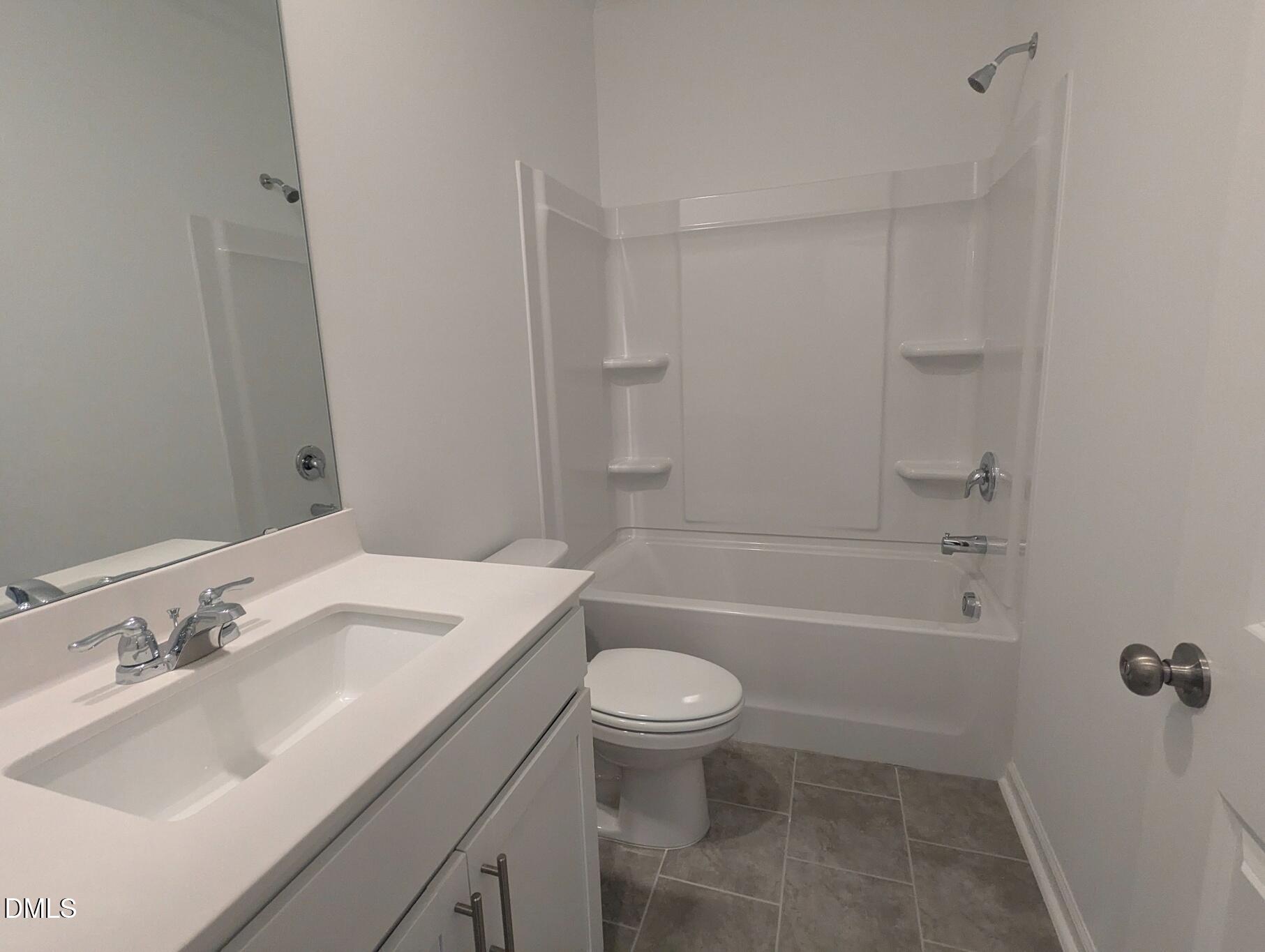 1000 Red Finch Way Angier, NC 27501 - Photo 12 of 31 a bathroom with a sink toilet and shower