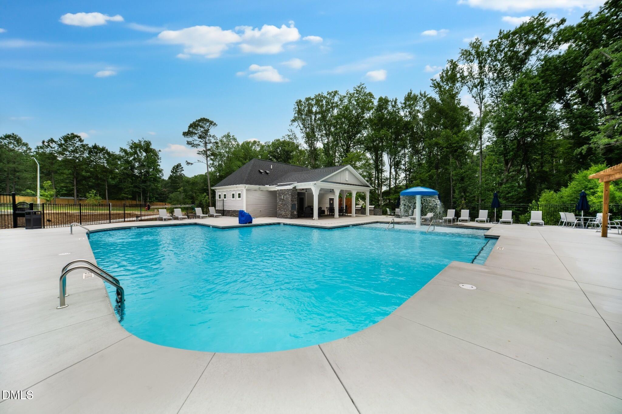 1000 Red Finch Way Angier, NC 27501 - Photo 28 of 31 a view of a swimming pool with a yard