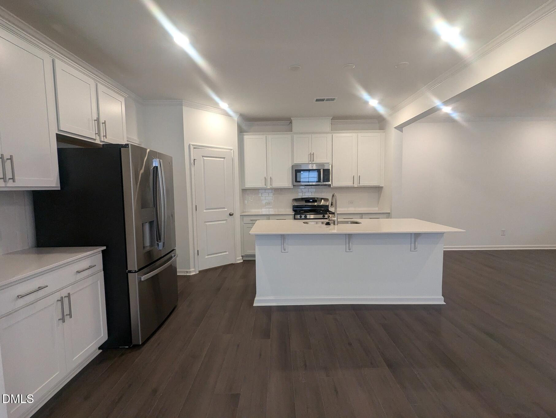 1000 Red Finch Way Angier, NC 27501 - Photo 8 of 31 a view of kitchen with stainless steel appliances a refrigerator and cabinets
