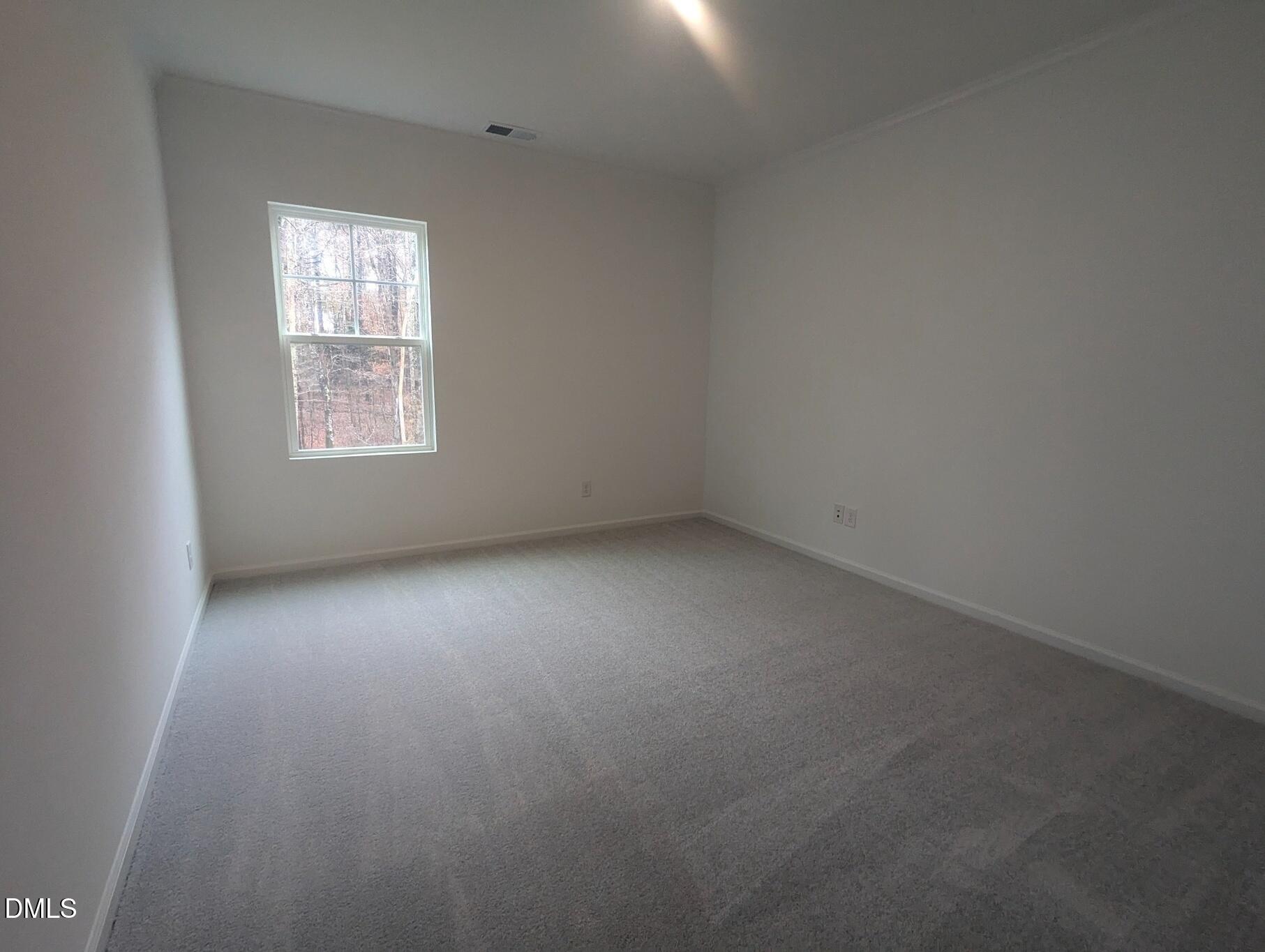 1000 Red Finch Way Angier, NC 27501 - Photo 10 of 31 an empty room with a window