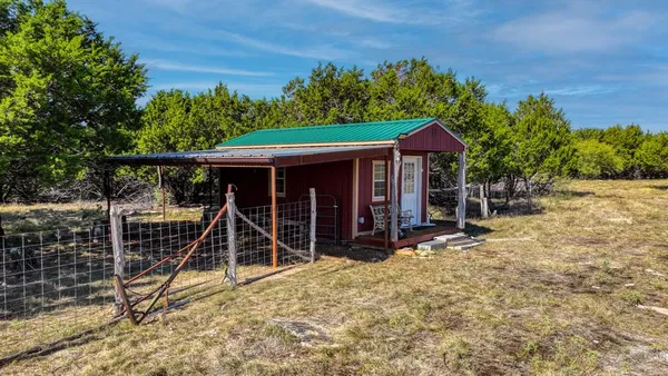 a view of chairs and table in patio