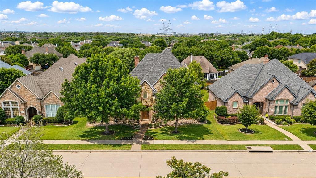 967 East Bethel School Road Coppell, TX 75019 - Photo 4 of 39 Stone and brick exterior residence featuring a gabled roofline