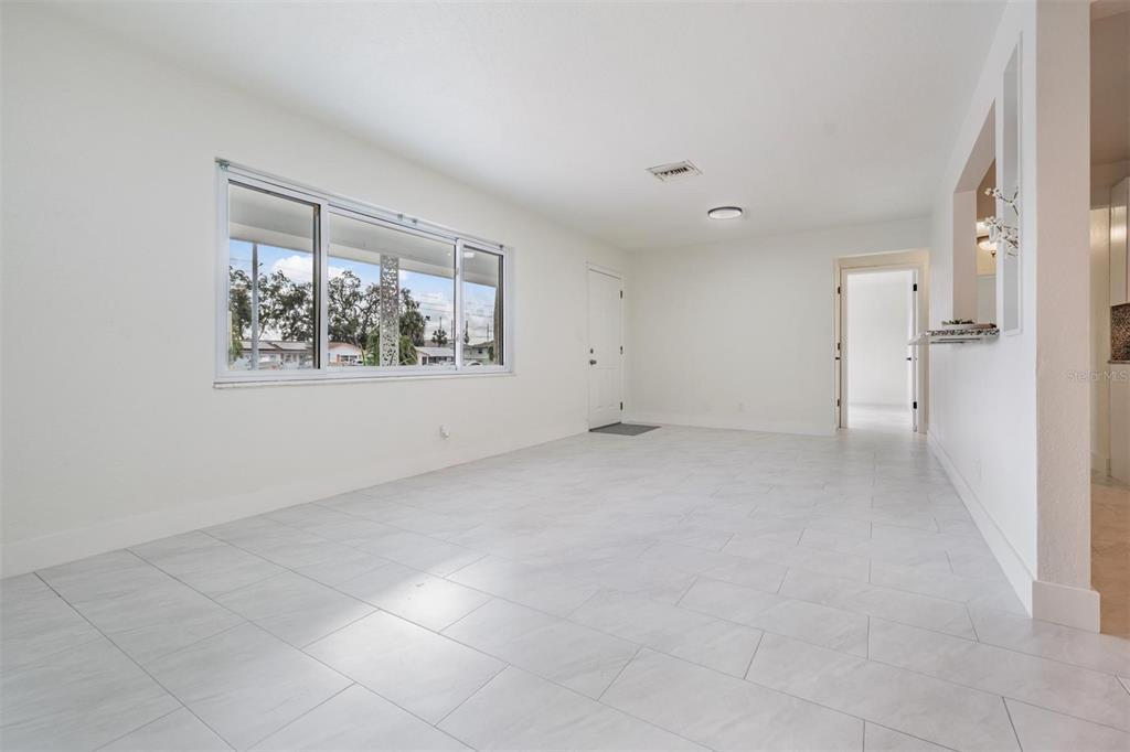6472 113th Street Seminole, FL 33772 - Photo 11 of 36 an empty room with windows