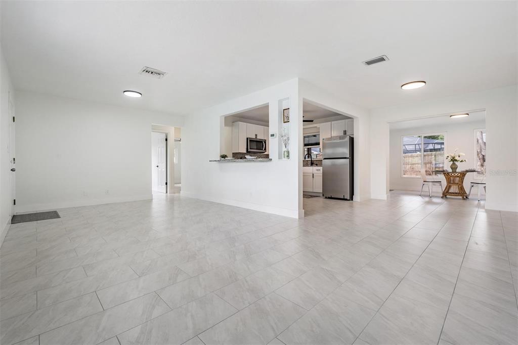 6472 113th Street Seminole, FL 33772 - Photo 12 of 36 a view of a kitchen with furniture and a kitchen