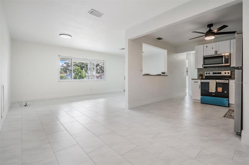 6472 113th Street Seminole, FL 33772 - Photo 13 of 36 a view of a kitchen with a sink and a stove top oven