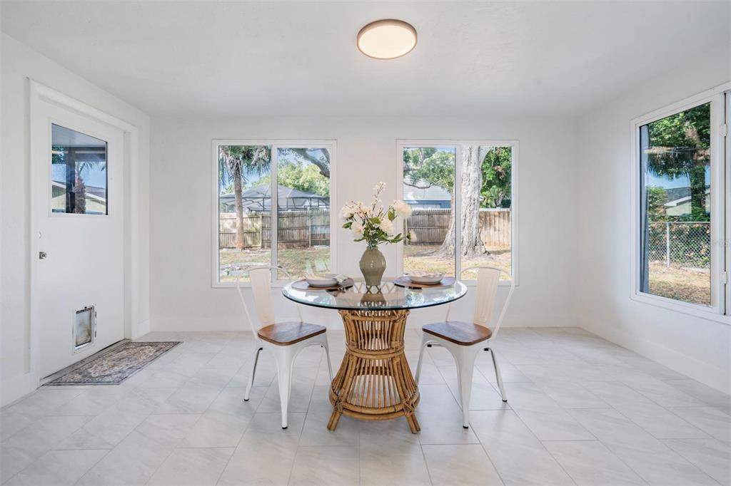 6472 113th Street Seminole, FL 33772 - Photo 21 of 36 a dining room with furniture and window