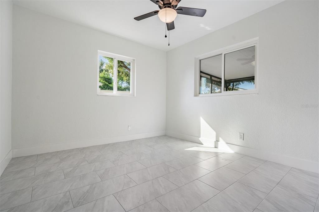 6472 113th Street Seminole, FL 33772 - Photo 26 of 36 a view of an empty room with a window