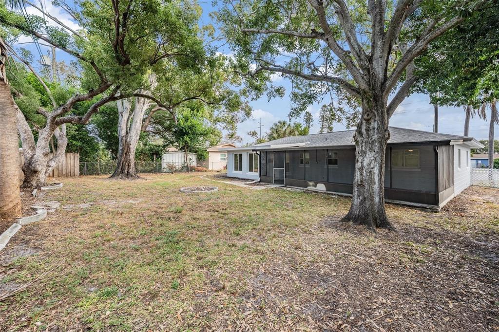 6472 113th Street Seminole, FL 33772 - Photo 31 of 36 a house with trees in front of it