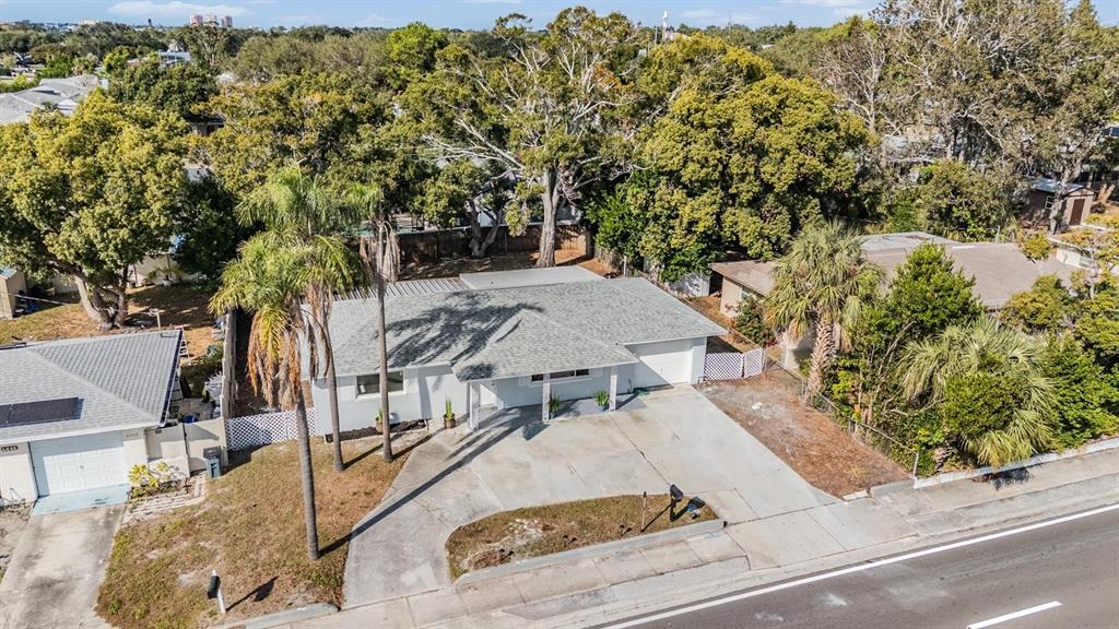 6472 113th Street Seminole, FL 33772 - Photo 5 of 36 aerial view of a house with yard and staircase