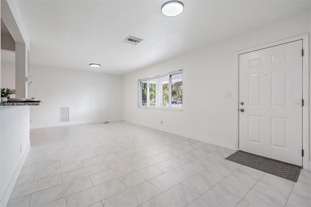 6472 113th Street Seminole, FL 33772 - Photo 10 of 36 an empty room with windows