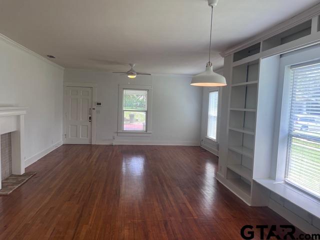 617 West Dobbs Street Tyler, TX 75701 - Photo 13 of 19 a view of an empty room with wooden floor and a window