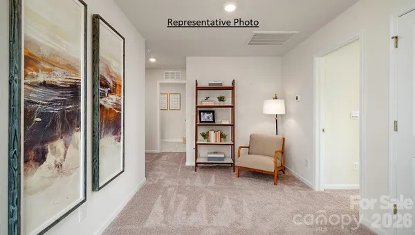a living room with furniture and closet