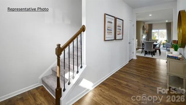a view of an entryway with wooden floor