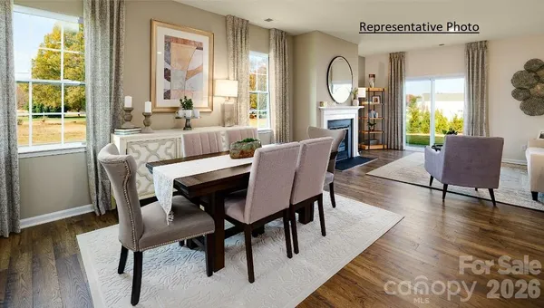 a dining room with furniture window wooden floor