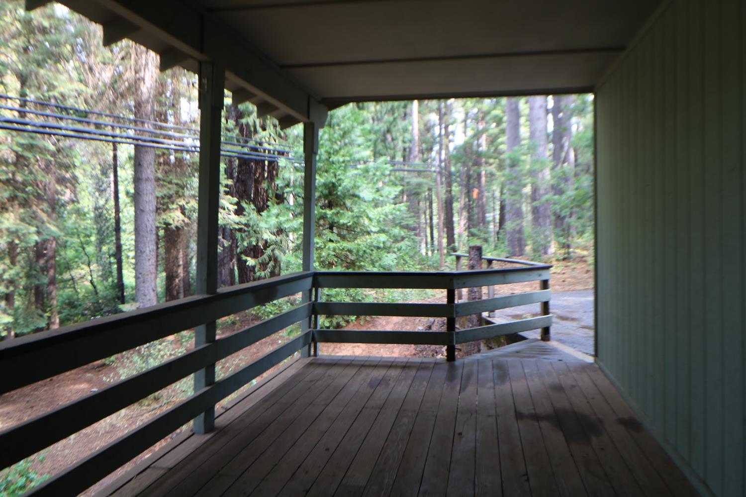 1536 Meadowview Road Arnold, CA 95223 - Photo 18 of 22 a view of a wooden bench in a balcony