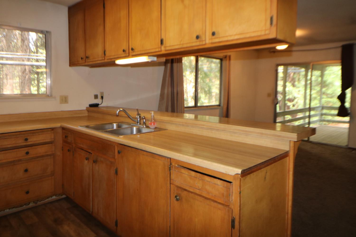 1536 Meadowview Road Arnold, CA 95223 - Photo 6 of 22 a kitchen with a sink and cabinets