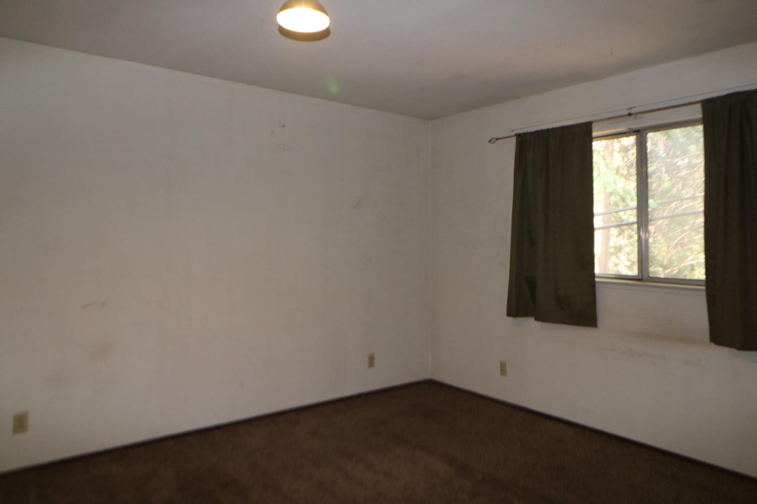 1536 Meadowview Road Arnold, CA 95223 - Photo 9 of 22 an empty room with windows