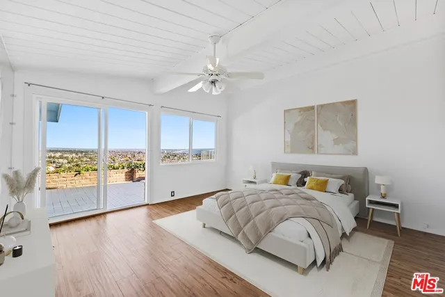 a spacious bedroom with a bed and a table