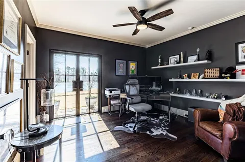 a living room with furniture or couch and a dining table with wooden floor