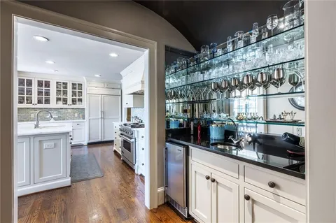 a kitchen with a sink and refrigerator