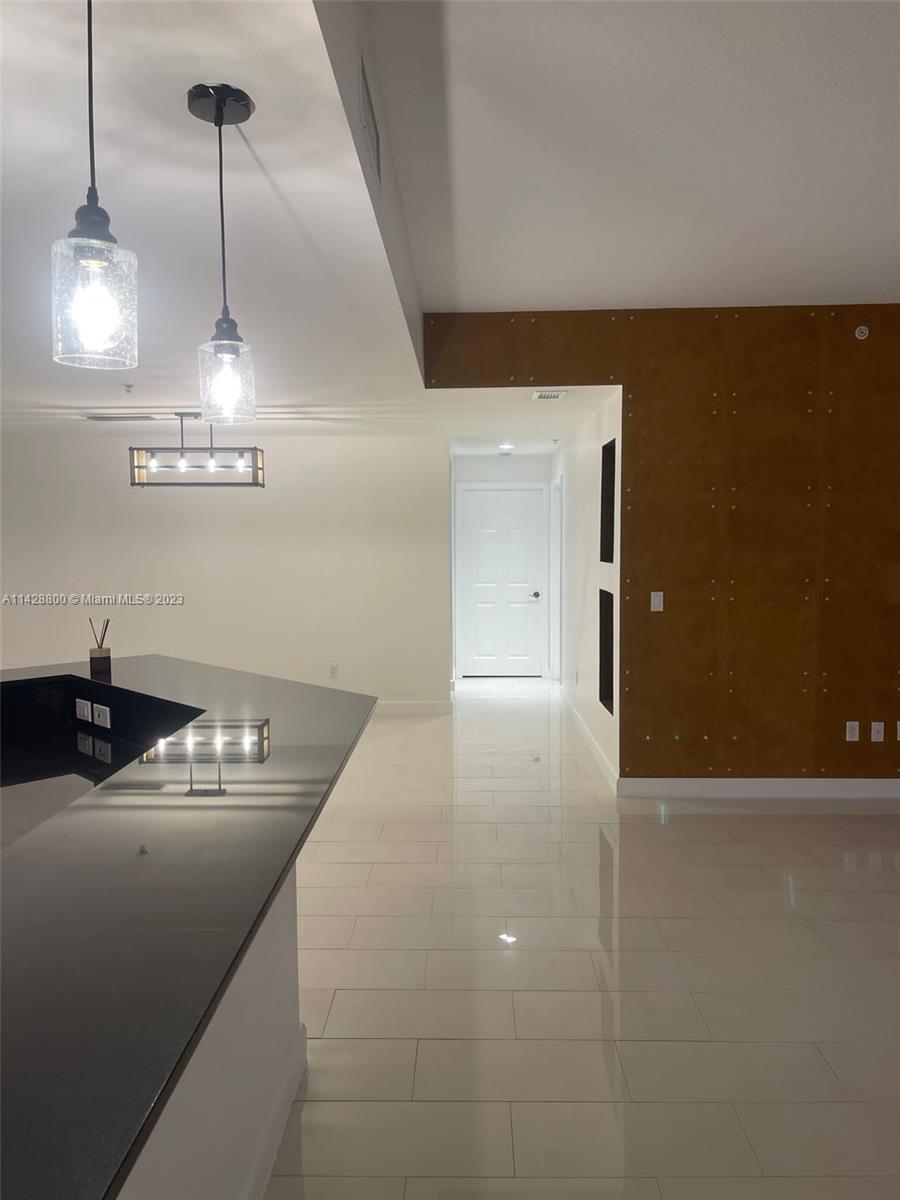 Se Colonnade at Dadeland Condominiums Miami, FL 33143 - Photo 13 of 32 a kitchen with a sink a counter space and cabinets