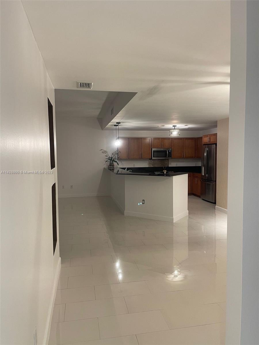Se Colonnade at Dadeland Condominiums Miami, FL 33143 - Photo 14 of 32 a kitchen with a refrigerator and a sink
