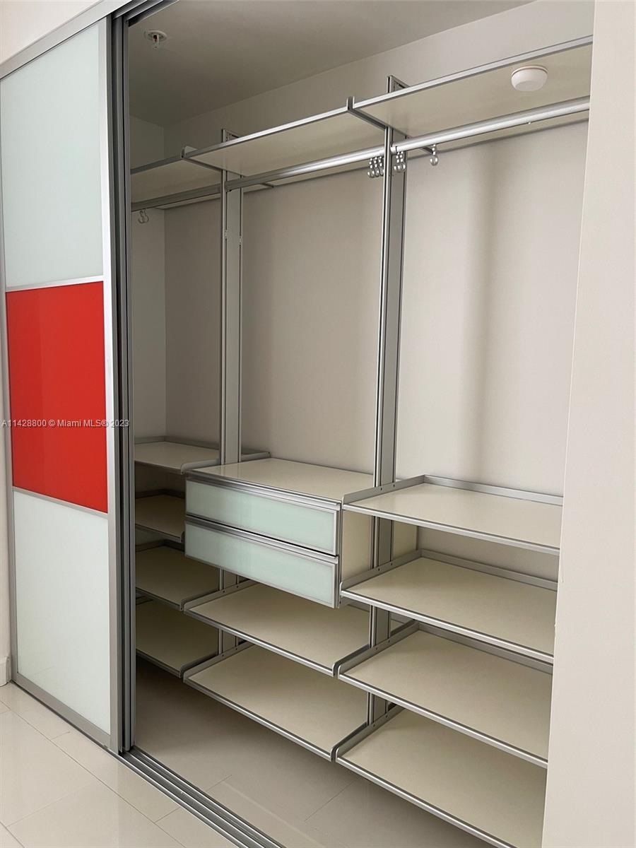 Se Colonnade at Dadeland Condominiums Miami, FL 33143 - Photo 22 of 32 a view of walk in closet with empty racks